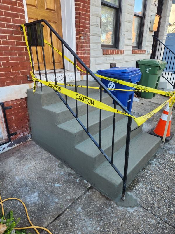New concrete front steps on a Baltimore rowhome