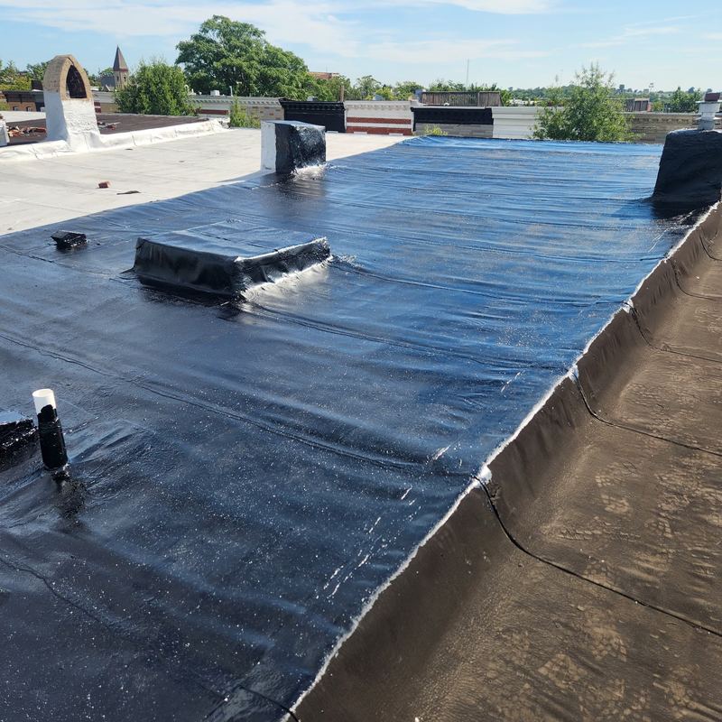 Flat roof membrane installation in progress
