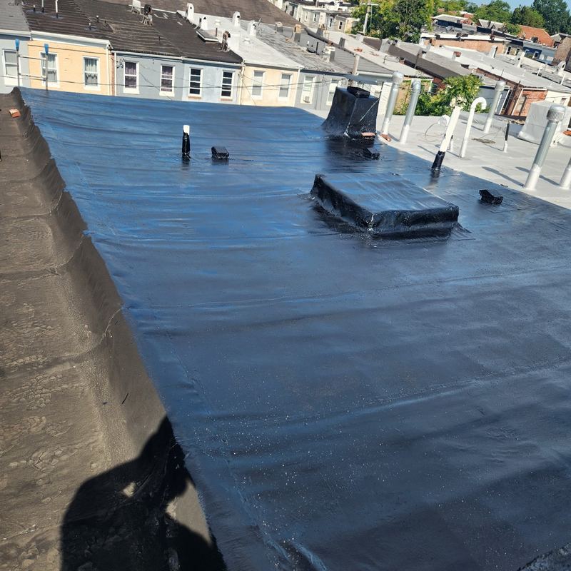 Completed rubber membrane flat roof on a Baltimore rowhome