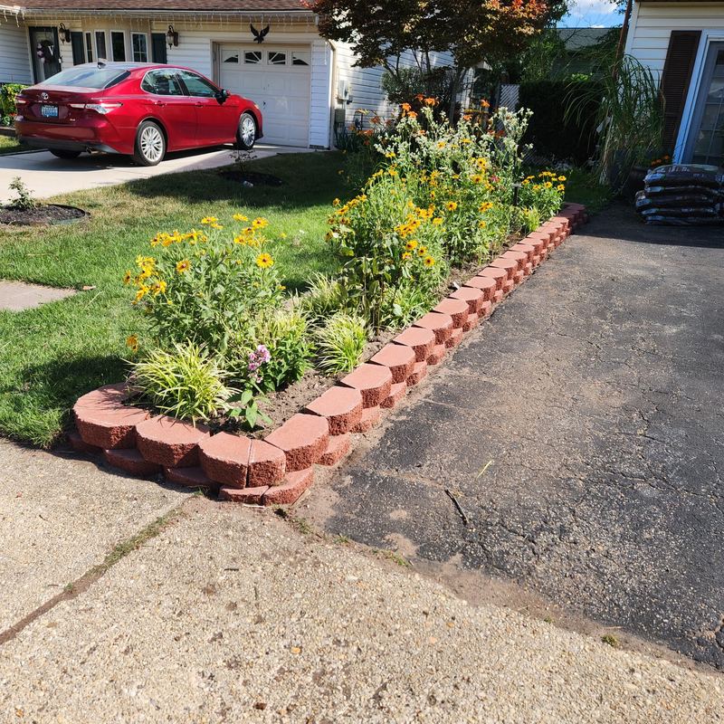 Retaining wall garden bed along a driveway