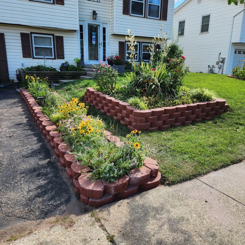 Block retaining wall with flower garden